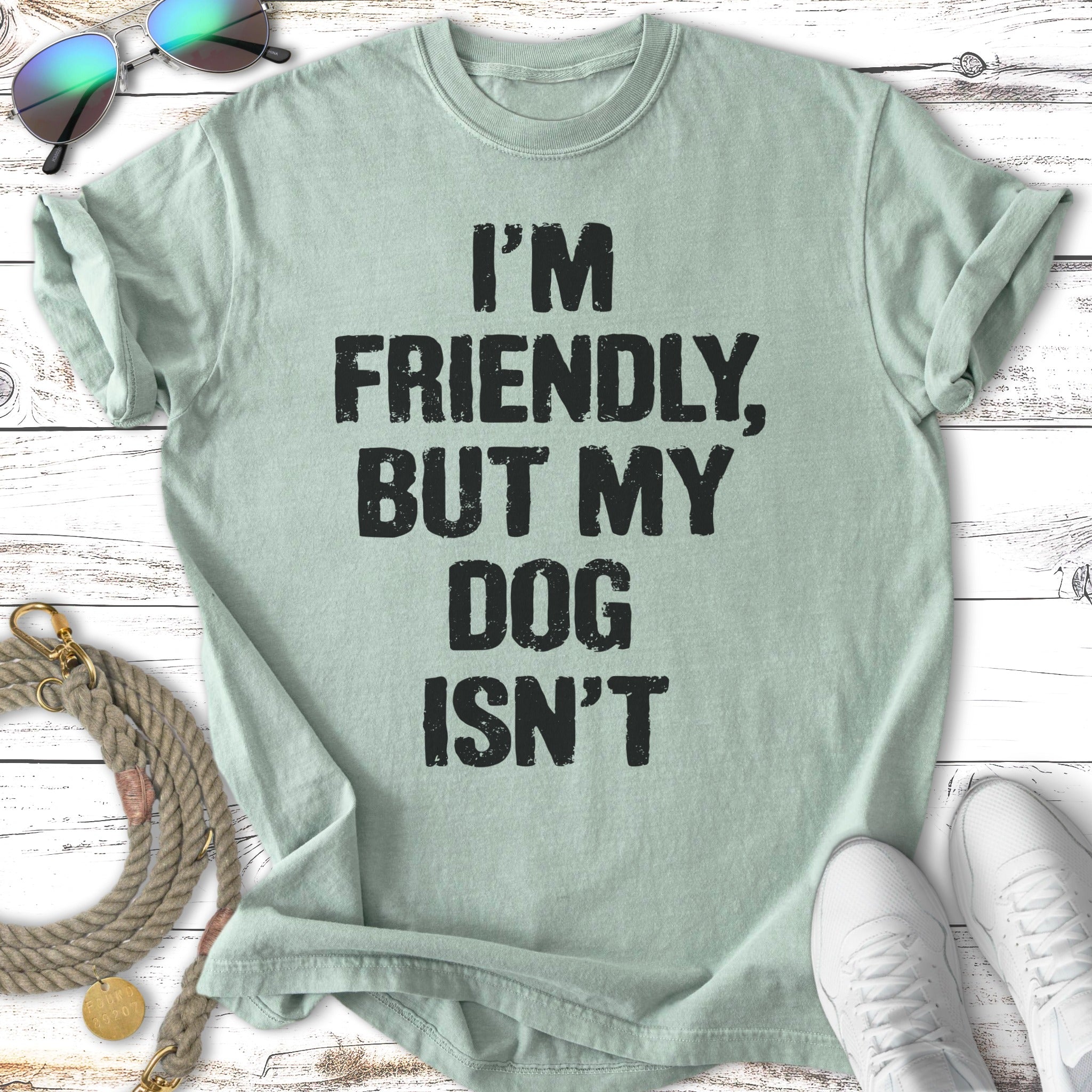 Mint t-shirt with black text "I'M FRIENDLY, BUT MY DOG ISN'T".