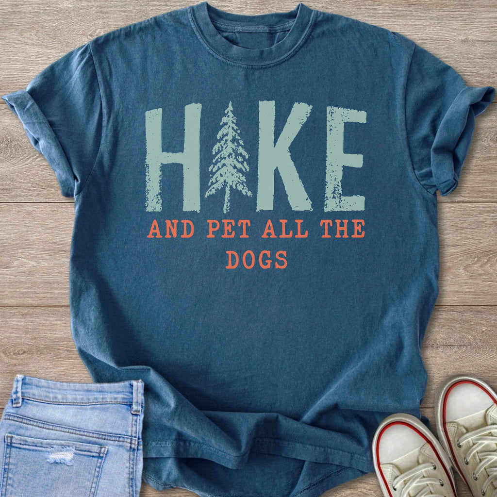 Blue t-shirt with "Hike and Pet All the Dogs" graphic.