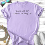 Lavender t-shirt with "dogs are my favorite people" text, sunglasses, and sneakers.