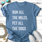 Blue t-shirt with text "Run All The Miles, Pet All The Dogs".