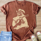 Brown t-shirt with a pug wearing a cowboy hat playing guitar graphic.