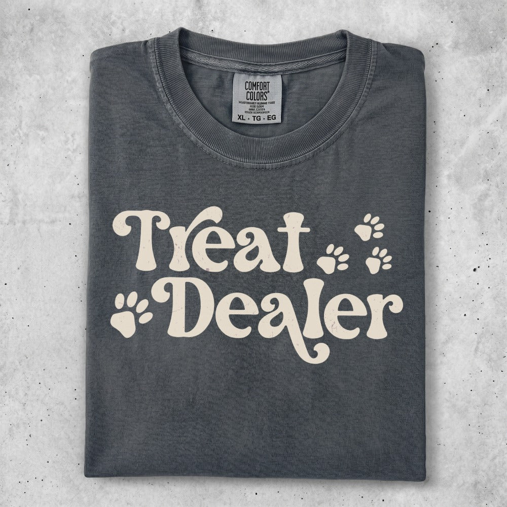 Comfort Colors charcoal t-shirt with "Treat Dealer" and paw print graphic.
