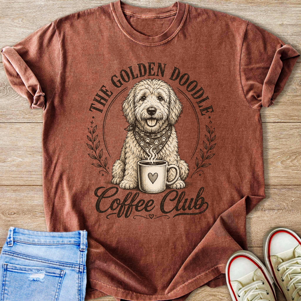 A golden doodle wearing a bandana sits next to a coffee mug with text "The Golden Doodle Coffee Club."
