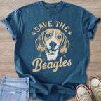 Blue t-shirt with beagle graphic and text "Save the Beagles".