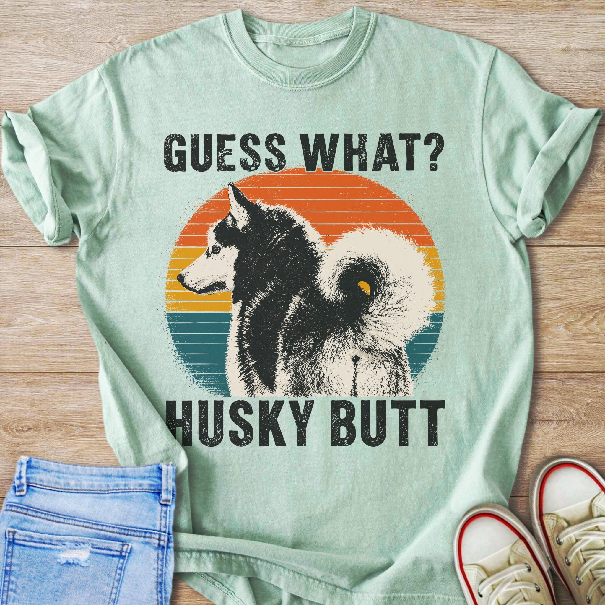 Graphic t-shirt with husky dog and text "Guess What? Husky Butt?"