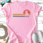 Pink t-shirt with a silhouette of a French bulldog against a retro sunset graphic.