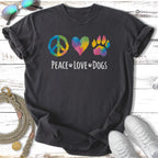 Dark t-shirt with peace sign, heart, and paw print in rainbow colors, "Peace Love Dogs" text.