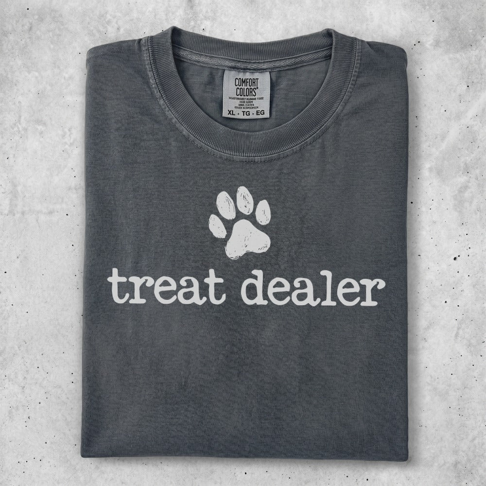 Dark grey t-shirt with a white paw print and "treat dealer" text.