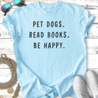 Light blue t-shirt with text "PET DOGS. READ BOOKS. BE HAPPY."
