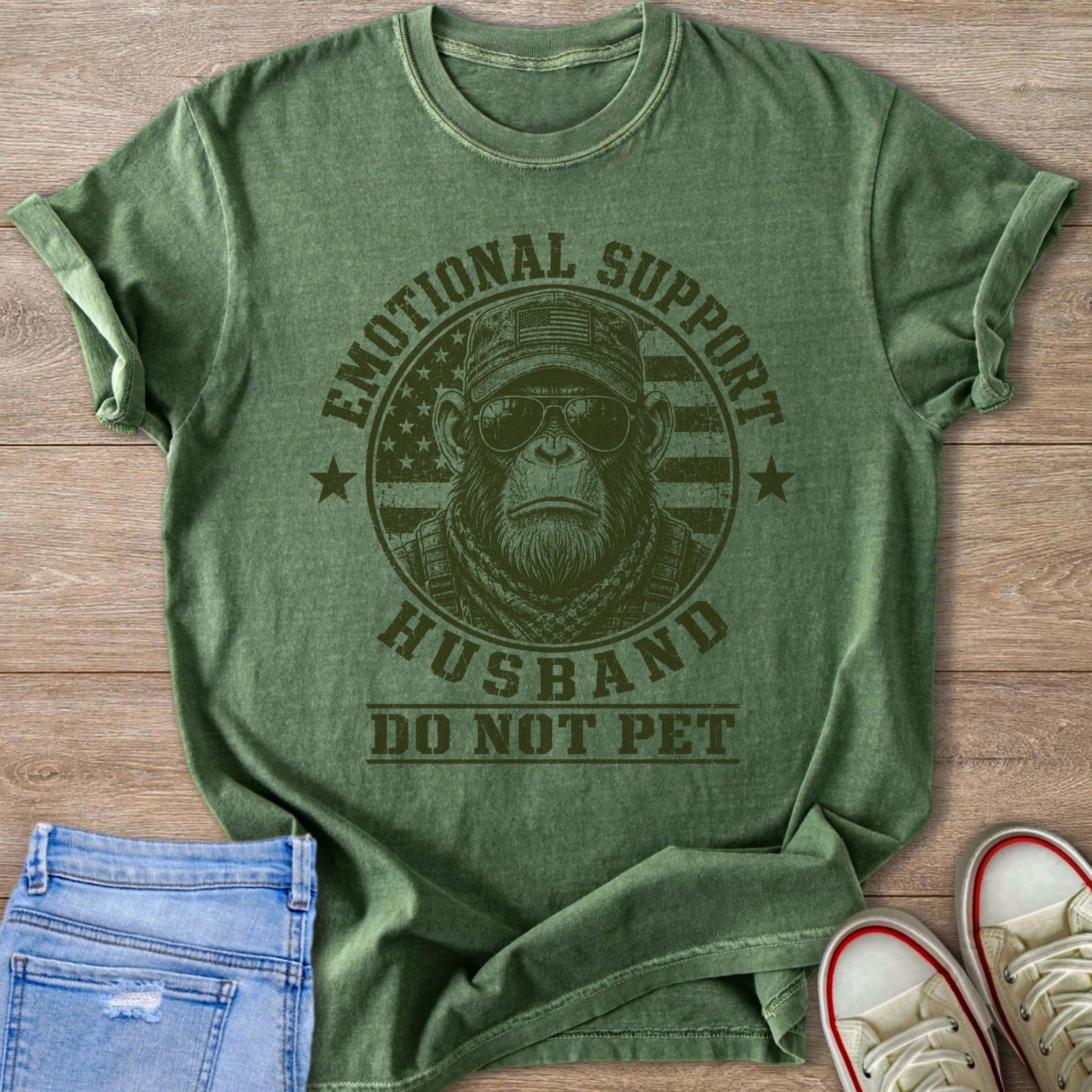 Green t-shirt with monkey wearing sunglasses and text: Emotional support husband do not pet.
