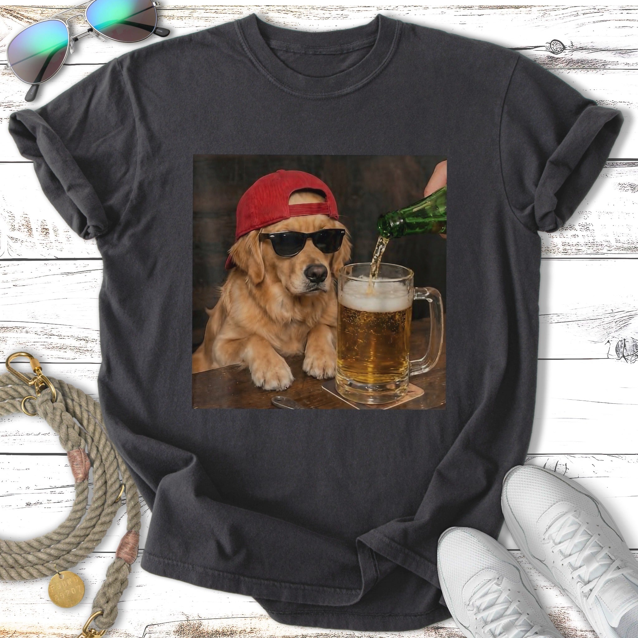 Golden retriever wearing sunglasses and red cap pours beer into a mug.