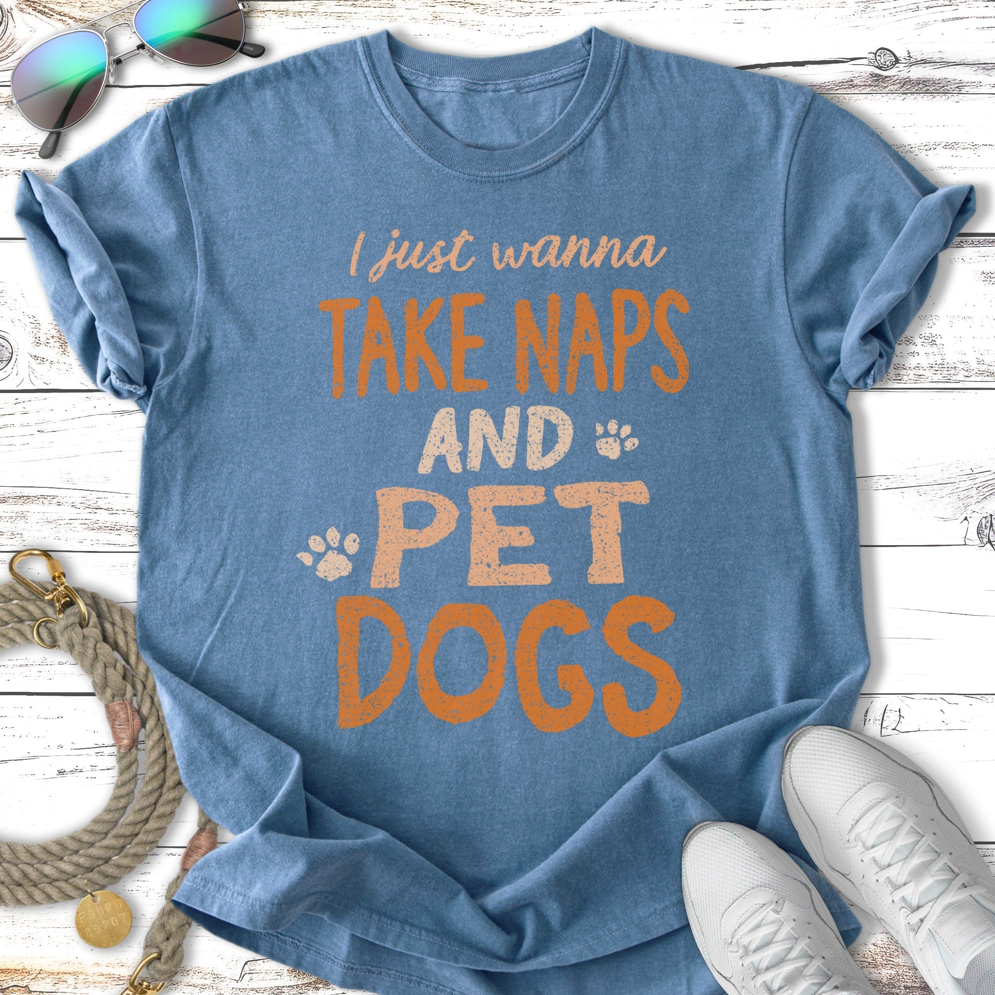 Blue t-shirt with orange text "I just wanna take naps and pet dogs".
