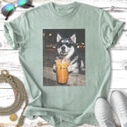 Husky dog wearing sunglasses drinks from a large iced coffee.