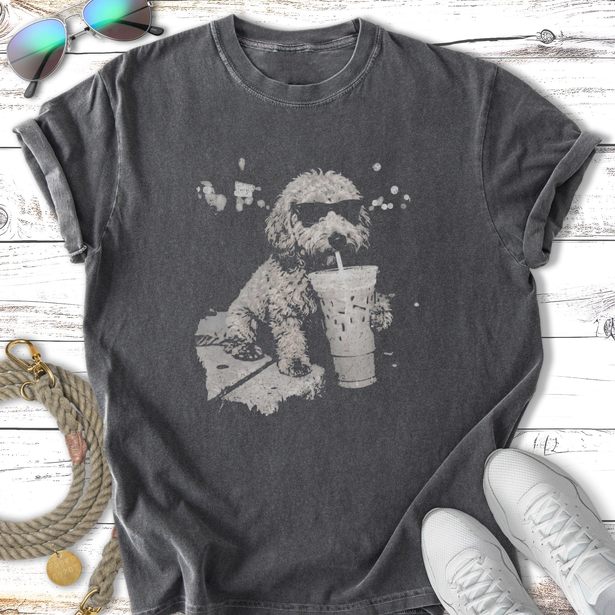 Dark t-shirt with a dog wearing sunglasses drinking from a large cup.
