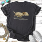 Small, light-brown dog splashing through puddle on dark t-shirt.