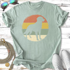 Mint green t-shirt with a dog silhouette in a vintage sunset graphic.