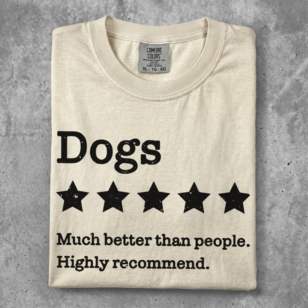Cream t-shirt with "Dogs" and five stars, text "Much better than people. Highly recommend."