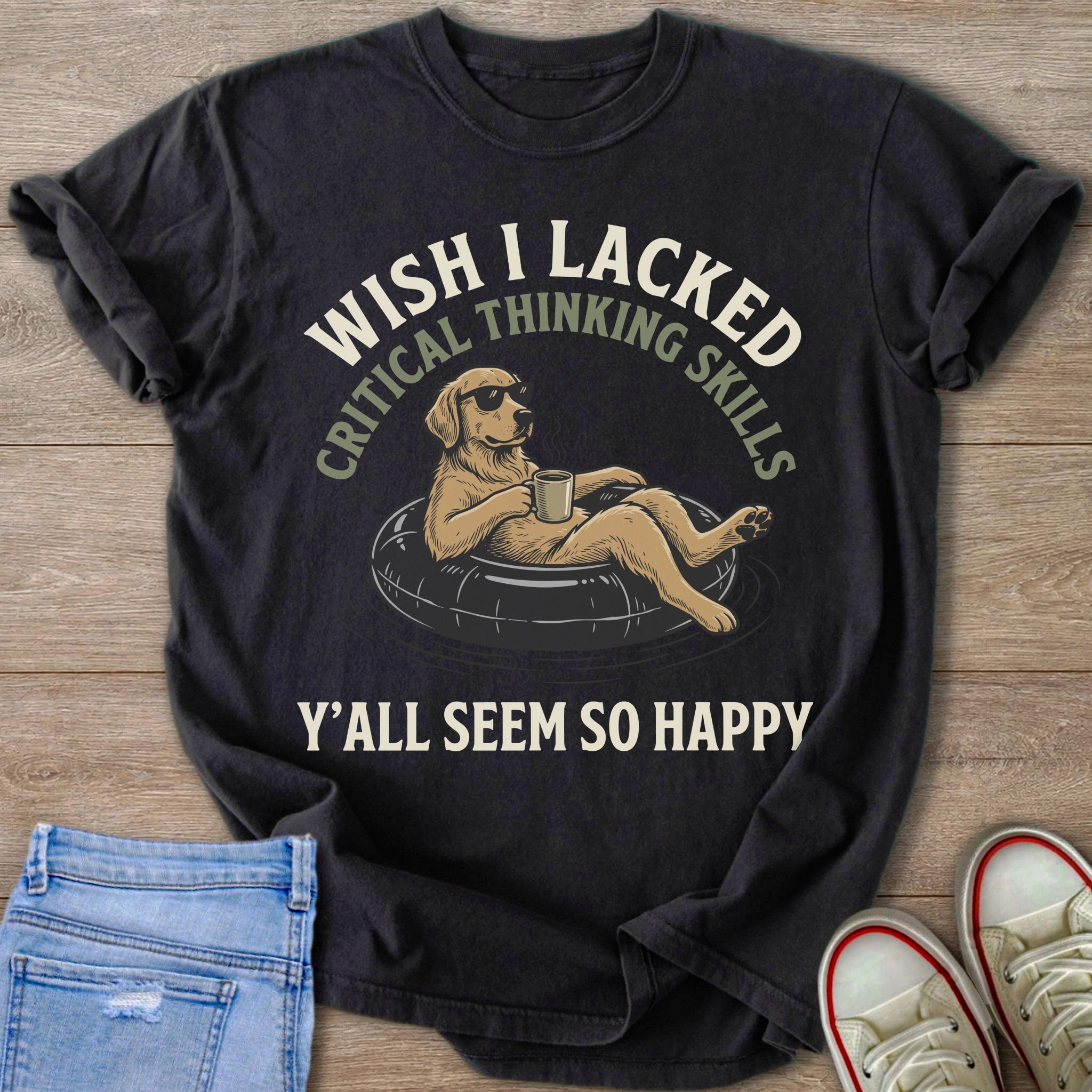 T-shirt with golden retriever on an inner tube, text reads "Wish I lacked critical thinking skills. Y'all seem so happy."