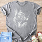 French bulldog blowing dandelion seeds in white sketch on gray t-shirt.