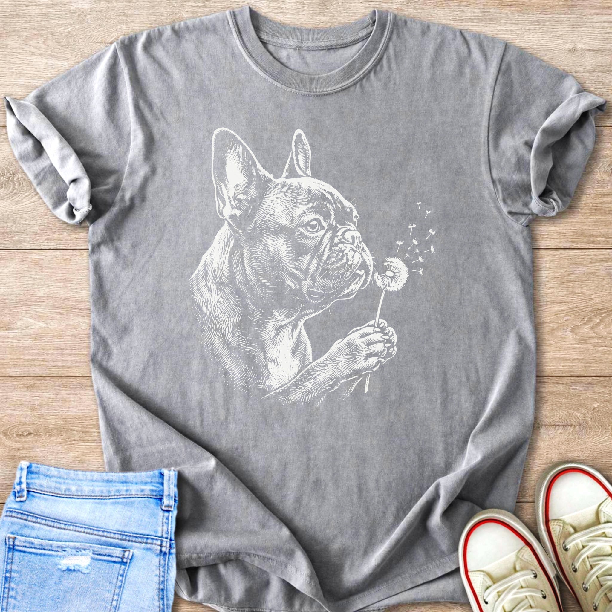 French bulldog blowing dandelion seeds in white sketch on gray t-shirt.