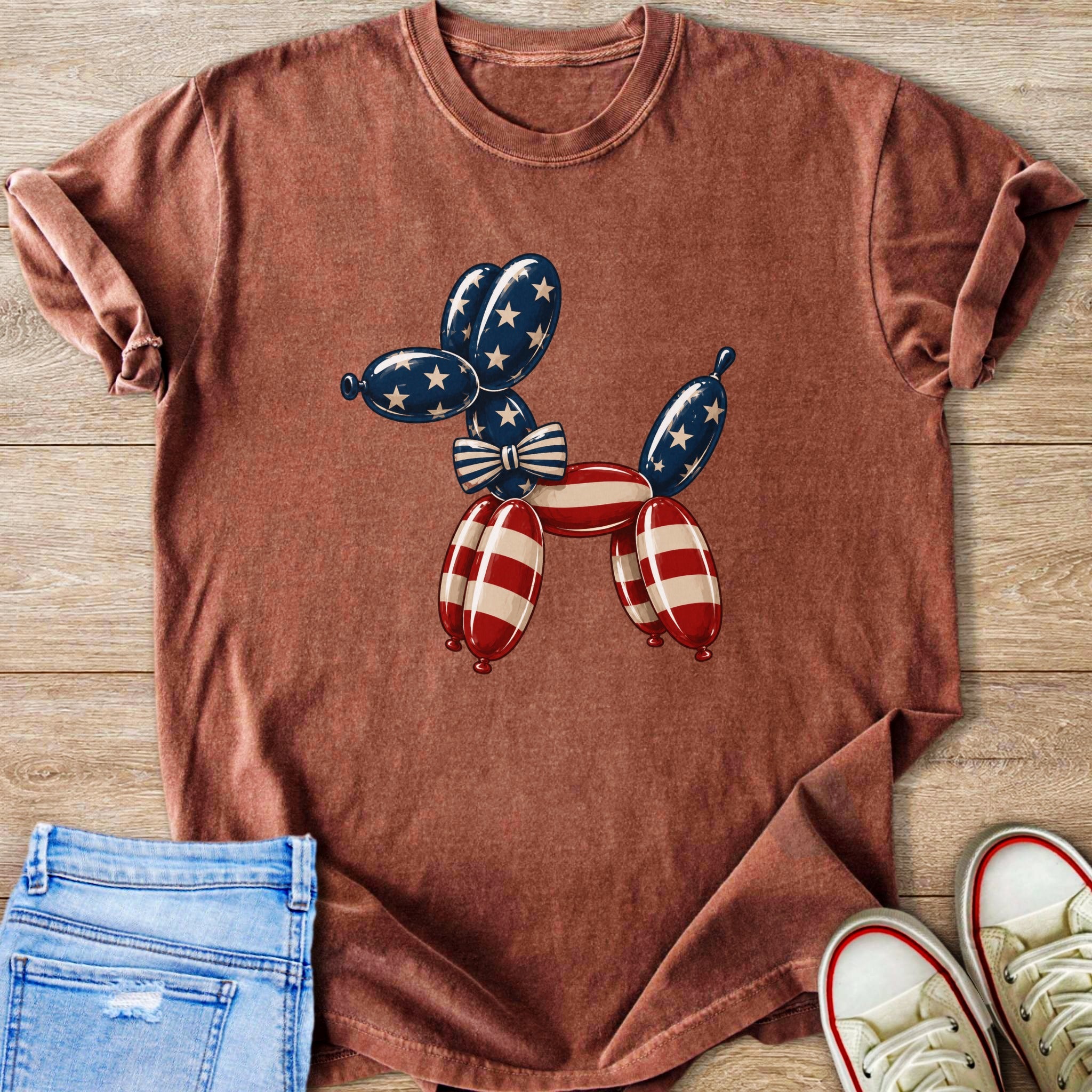 Red t-shirt with a dog shaped balloon graphic in American flag colors.