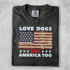 Black t-shirt with "LOVE DOGS AND AMERICA TOO" and an American flag with paw prints.