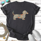 Dark t-shirt with a silhouette of a dachshund filled with a floral pattern.