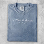 Blue t-shirt with "coffee & dogs." graphic.
