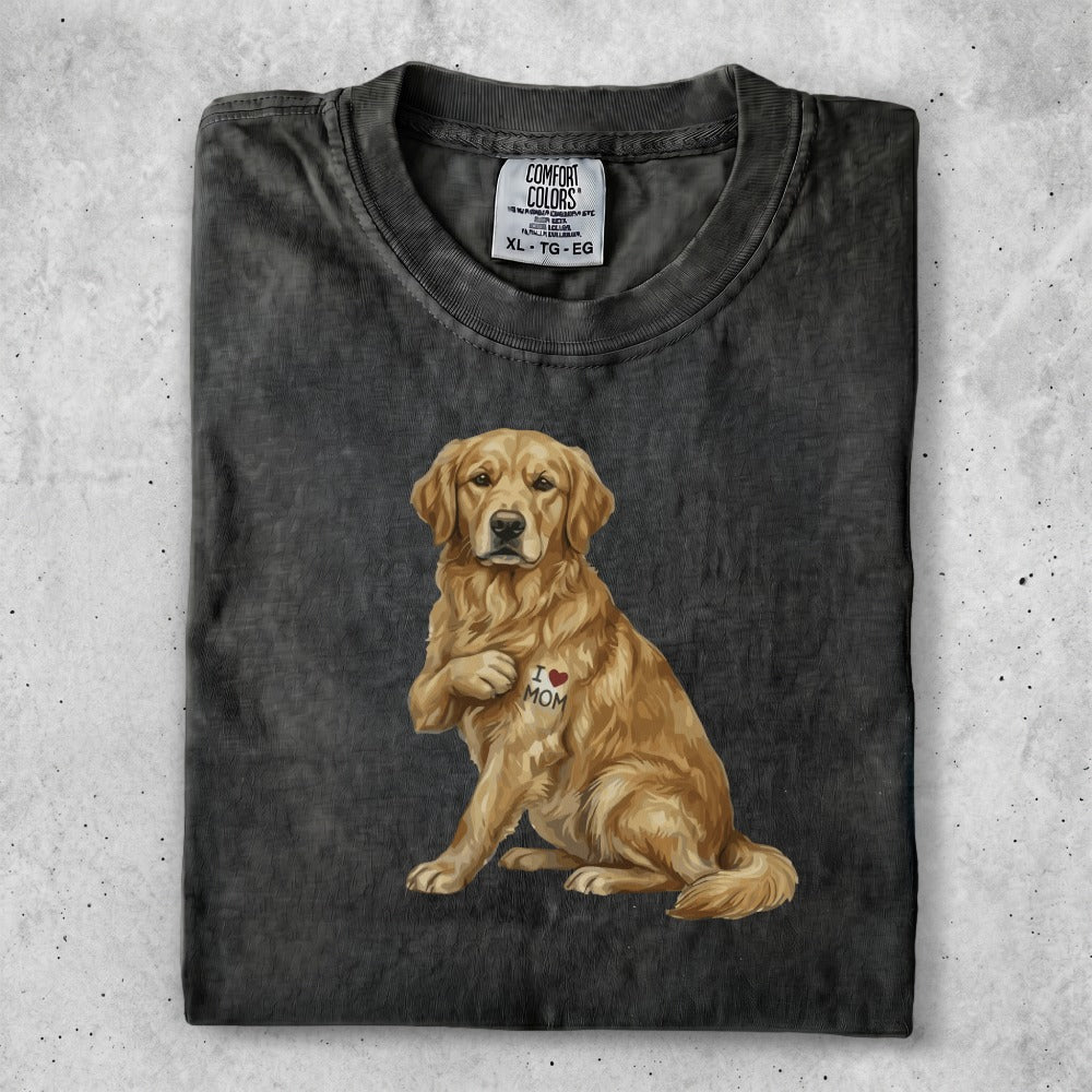Golden retriever with "I MOM" heart tattoo on its chest.