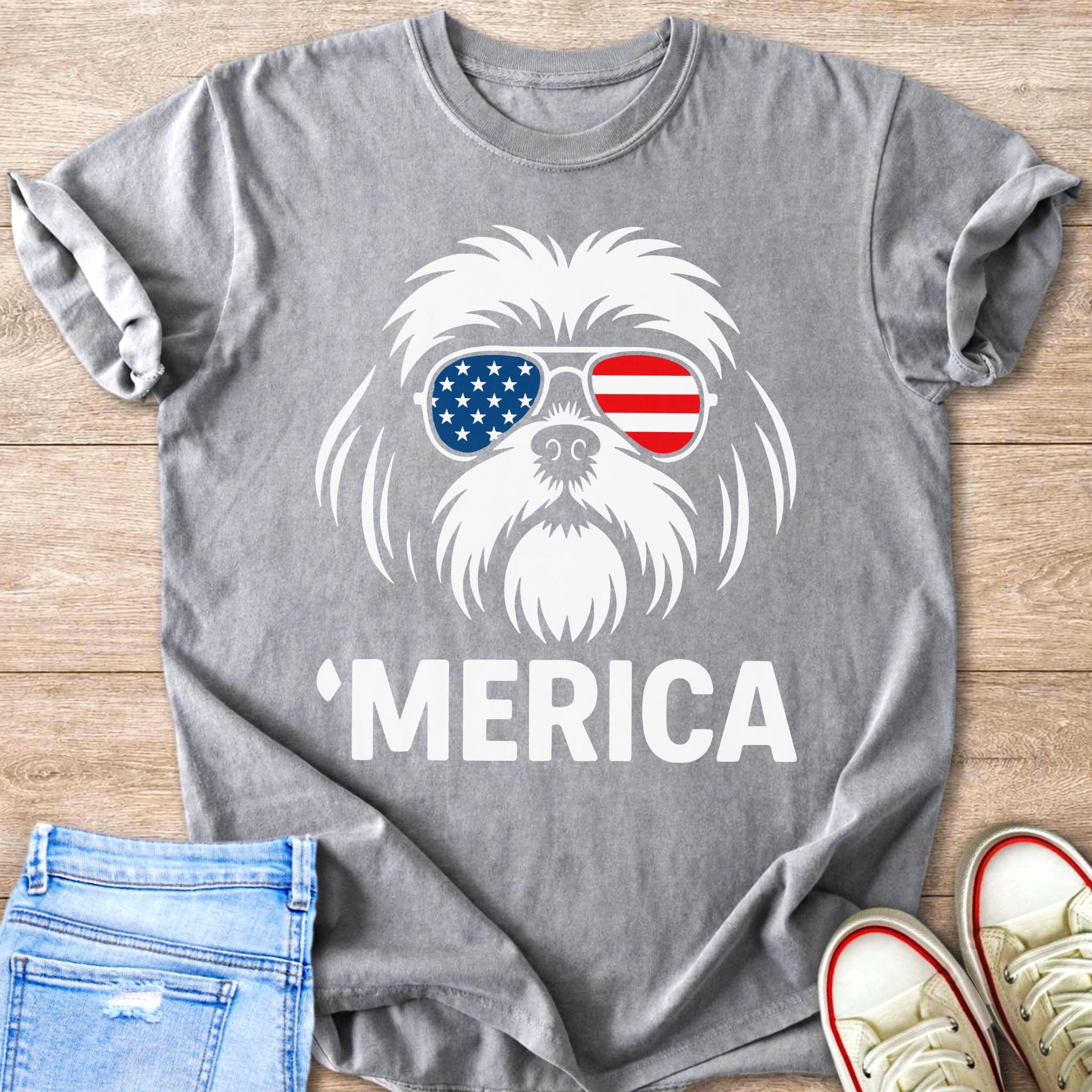 Gray t-shirt with white graphic of dog wearing American flag sunglasses and text "MERICA".