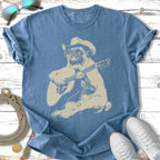 Pug wearing a cowboy hat plays an acoustic guitar.