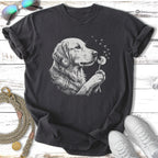Golden retriever dog with a dandelion on a dark t-shirt.