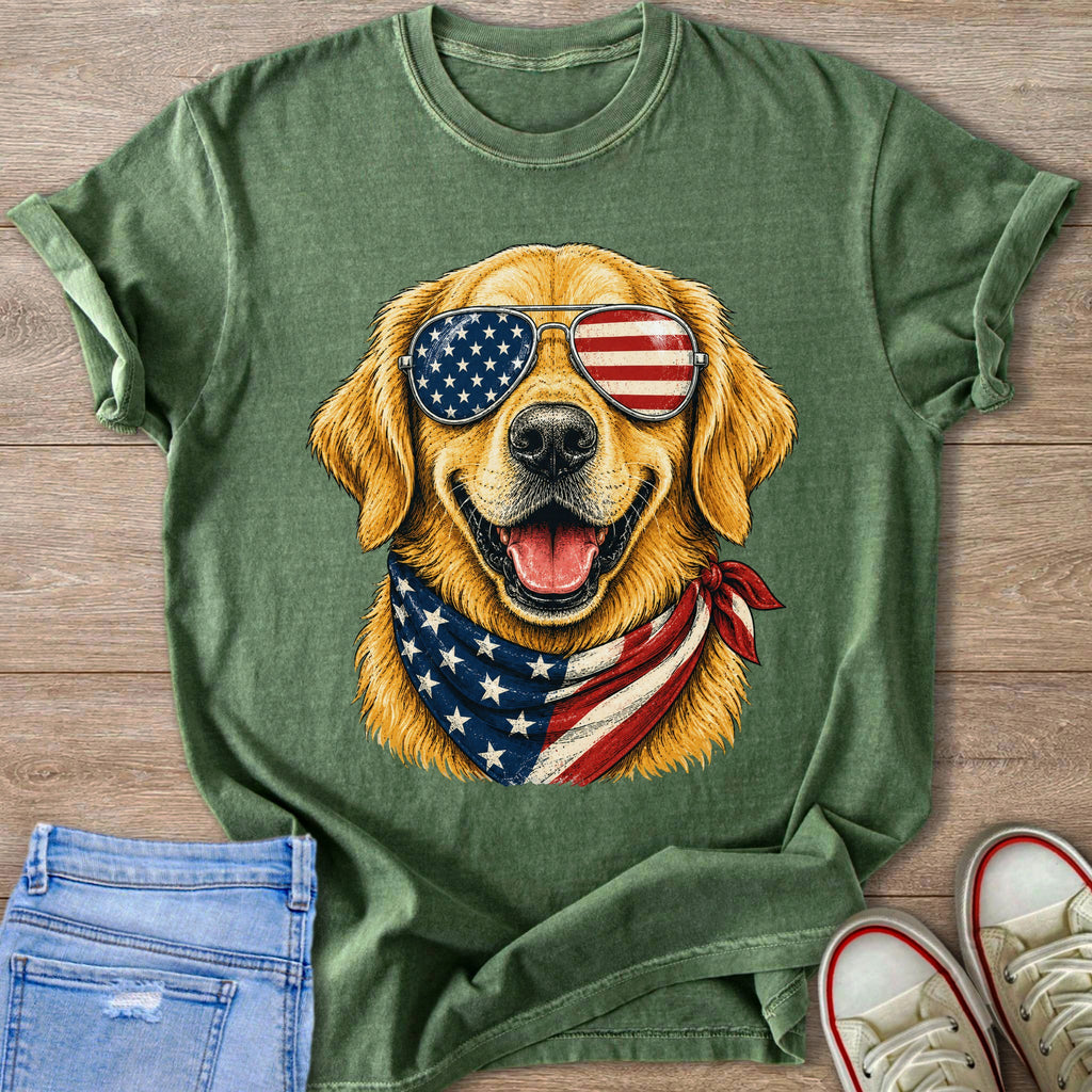 Golden retriever wearing American flag bandana and aviator sunglasses, printed on a green t-shirt.