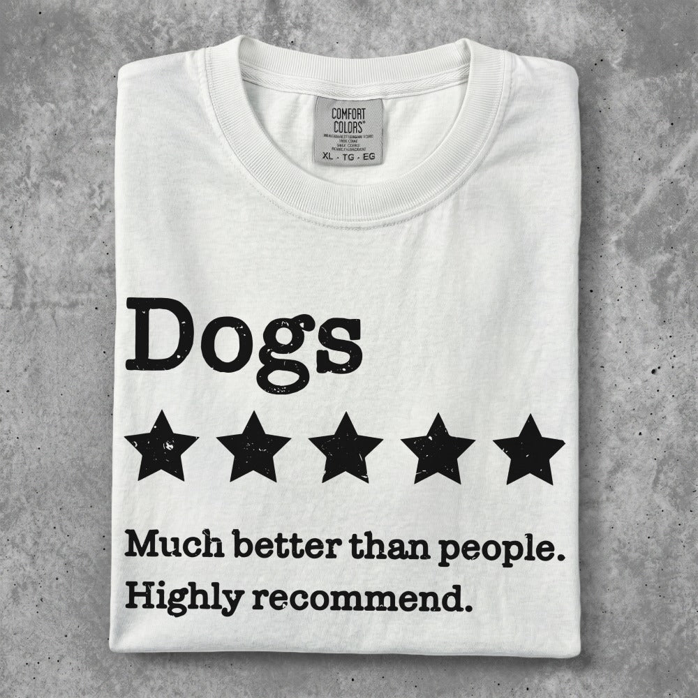 White t-shirt with "Dogs" text and five stars, below text "Much better than people."