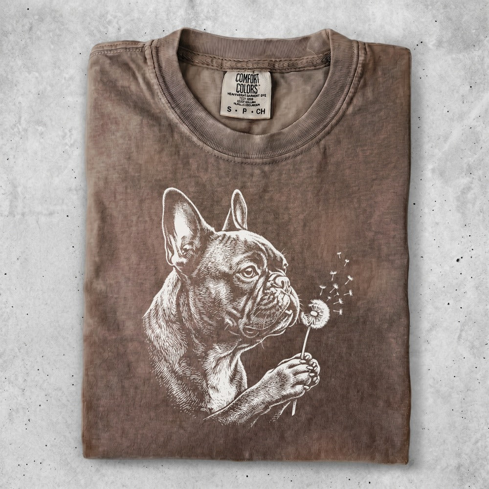 Brown t-shirt with a graphic of a French bulldog sniffing a dandelion.