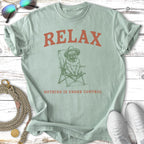 Light green t-shirt with pug in a hat and chair graphic and "RELAX NOTHING IS UNDER CONTROL" text.