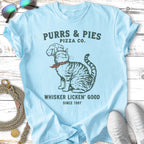 Purrs & Pies Pizza Co. t-shirt with cat wearing chef hat, says "Whisker Licken' Good".