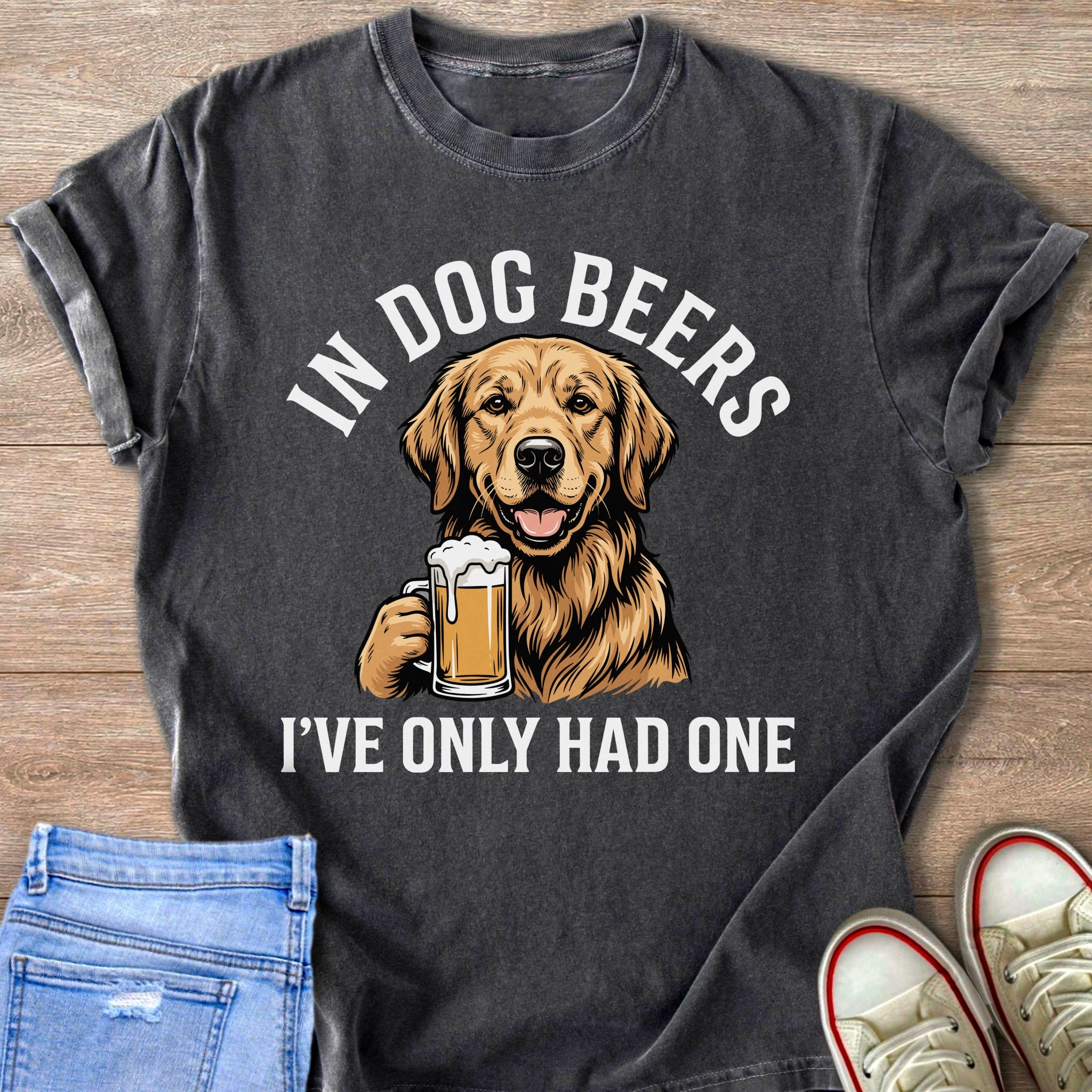 T-shirt graphic of a Golden Retriever holding a beer mug with text "IN DOG BEERS I'VE ONLY HAD ONE".