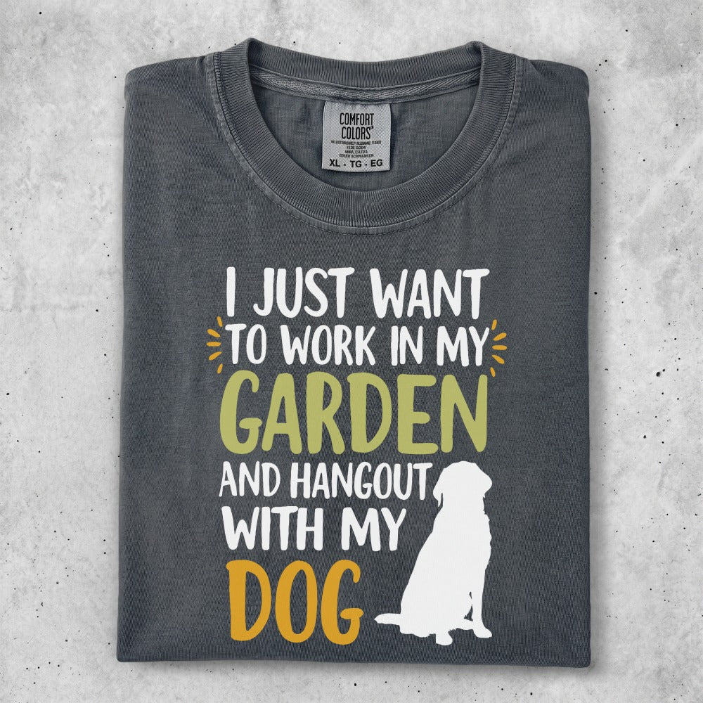 Dark gray t-shirt with white dog silhouette and text about gardening and dogs.