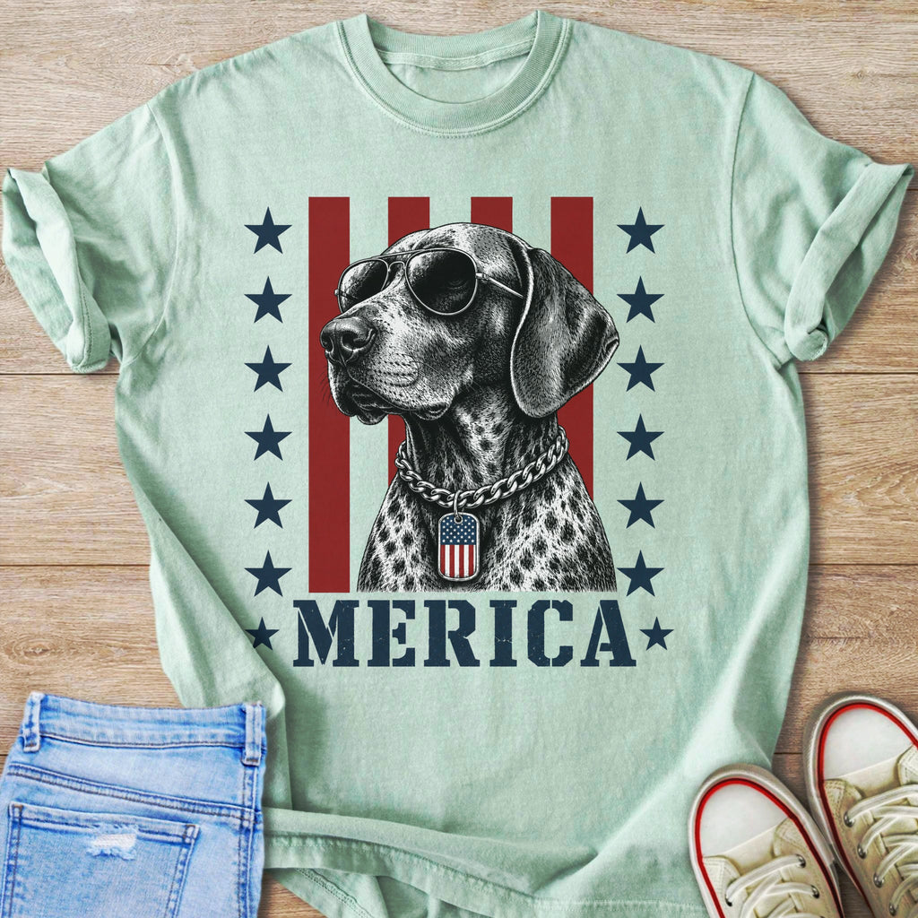 German Shorthaired Pointer wearing sunglasses and dog tag with "MERICA" text.