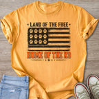 Orange t-shirt with American flag design featuring paw prints and "Land of the Free Home of the K9" text.