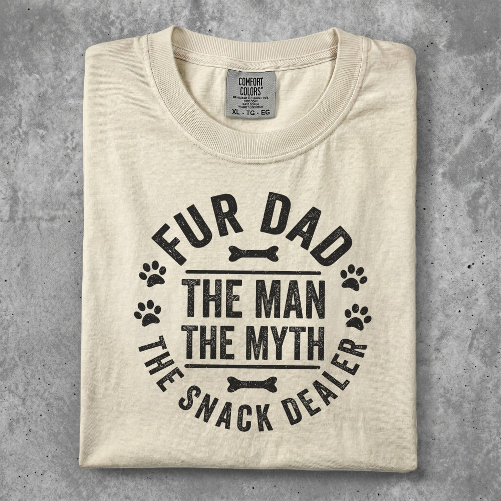 Cream t-shirt with "Fur Dad, The Man, The Myth, The Snack Dealer" text.