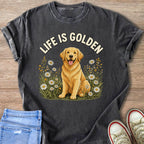 Dark gray t-shirt with a golden retriever sitting in flowers and text "LIFE IS GOLDEN".