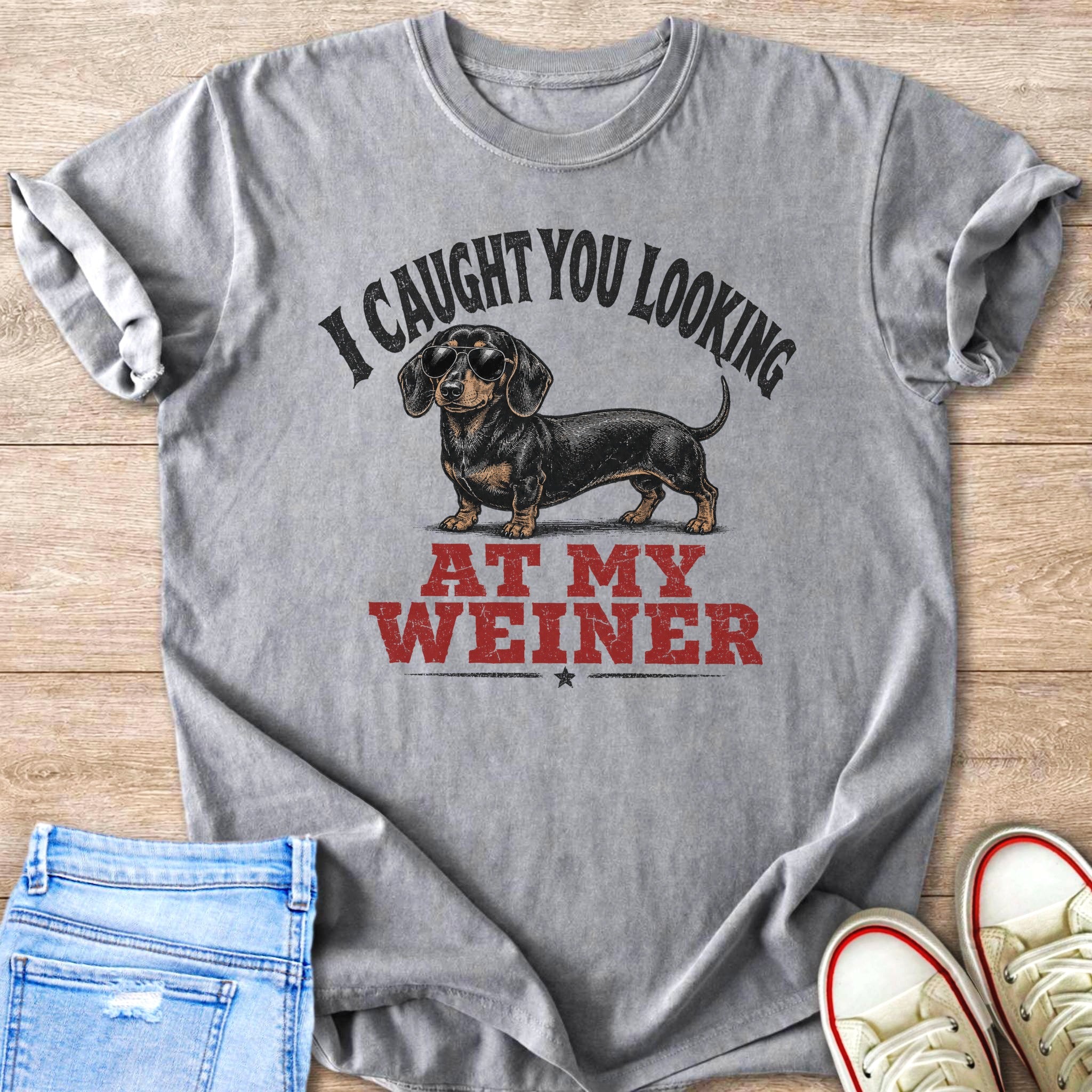 Gray t-shirt with a dachshund graphic and text "I CAUGHT YOU LOOKING AT MY WEINER".