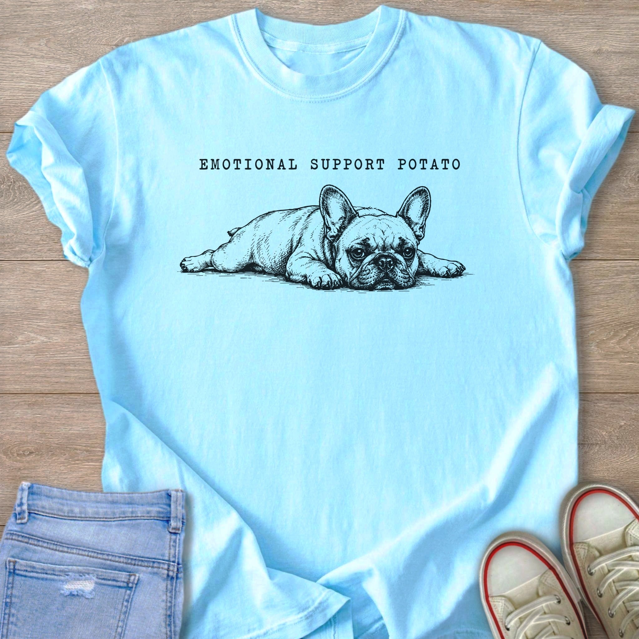 Light blue t-shirt with sketch of French bulldog and text "EMOTIONAL SUPPORT POTATO".