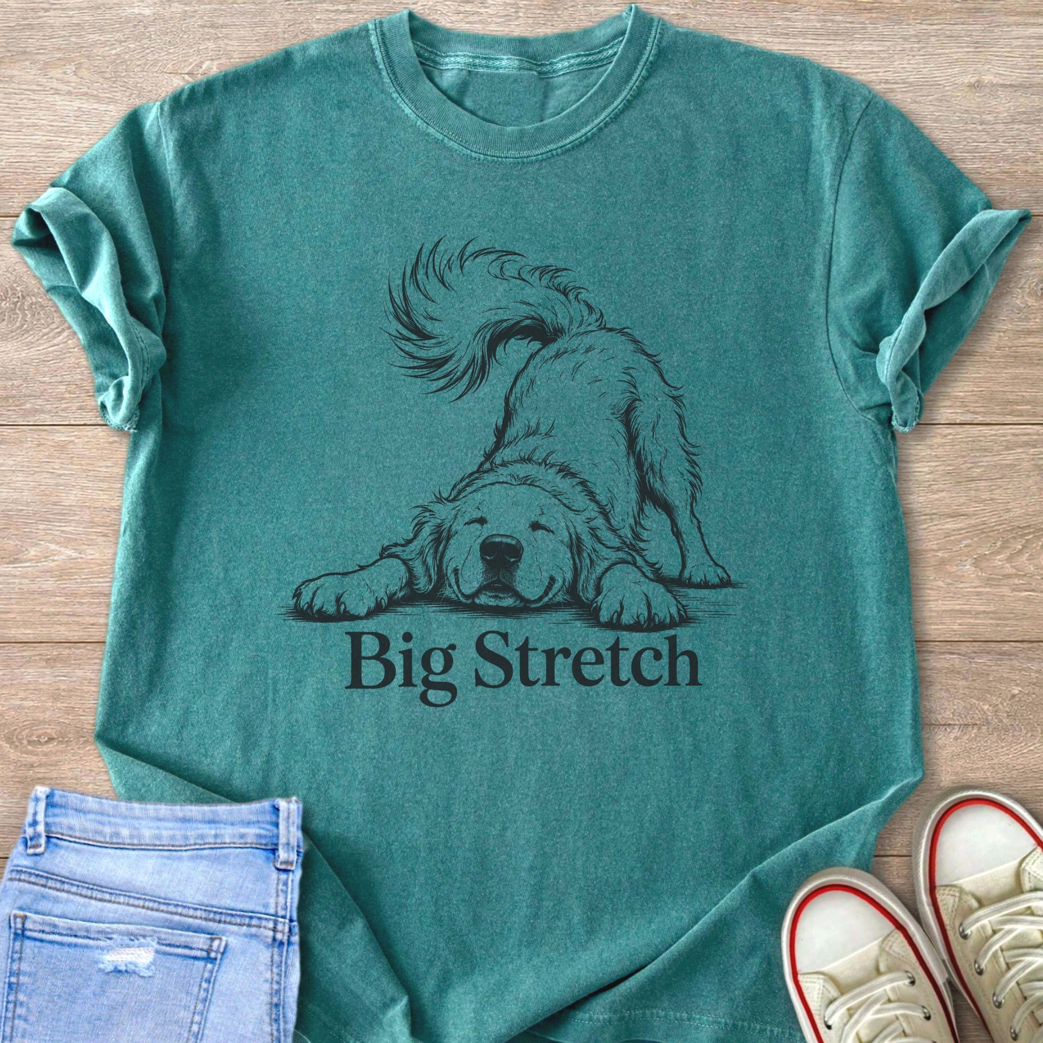 Teal t-shirt with a sketch of a happy dog stretching and text "Big Stretch".