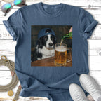 Border collie in a blue cap pours beer into a mug on a wooden table.