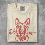 Cream t-shirt with a red graphic of a German Shepherd holding a rose in its mouth.