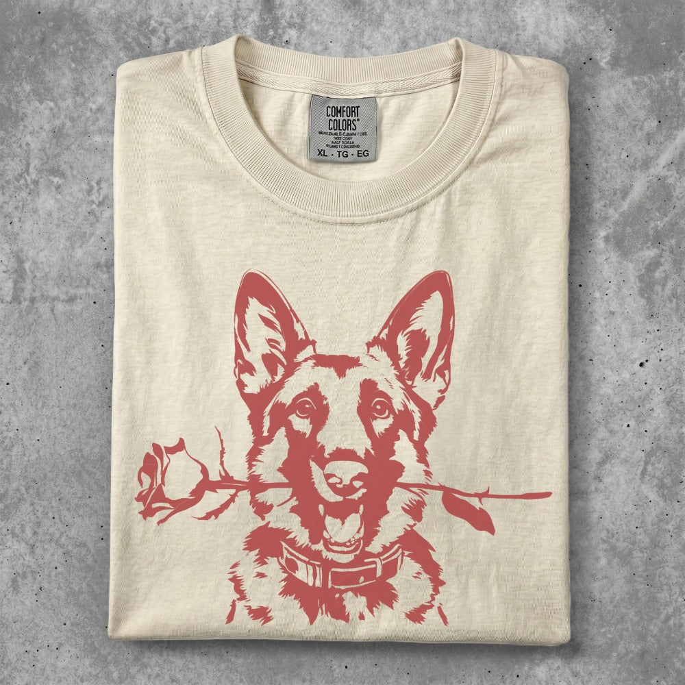 Cream t-shirt with a red graphic of a German Shepherd holding a rose in its mouth.