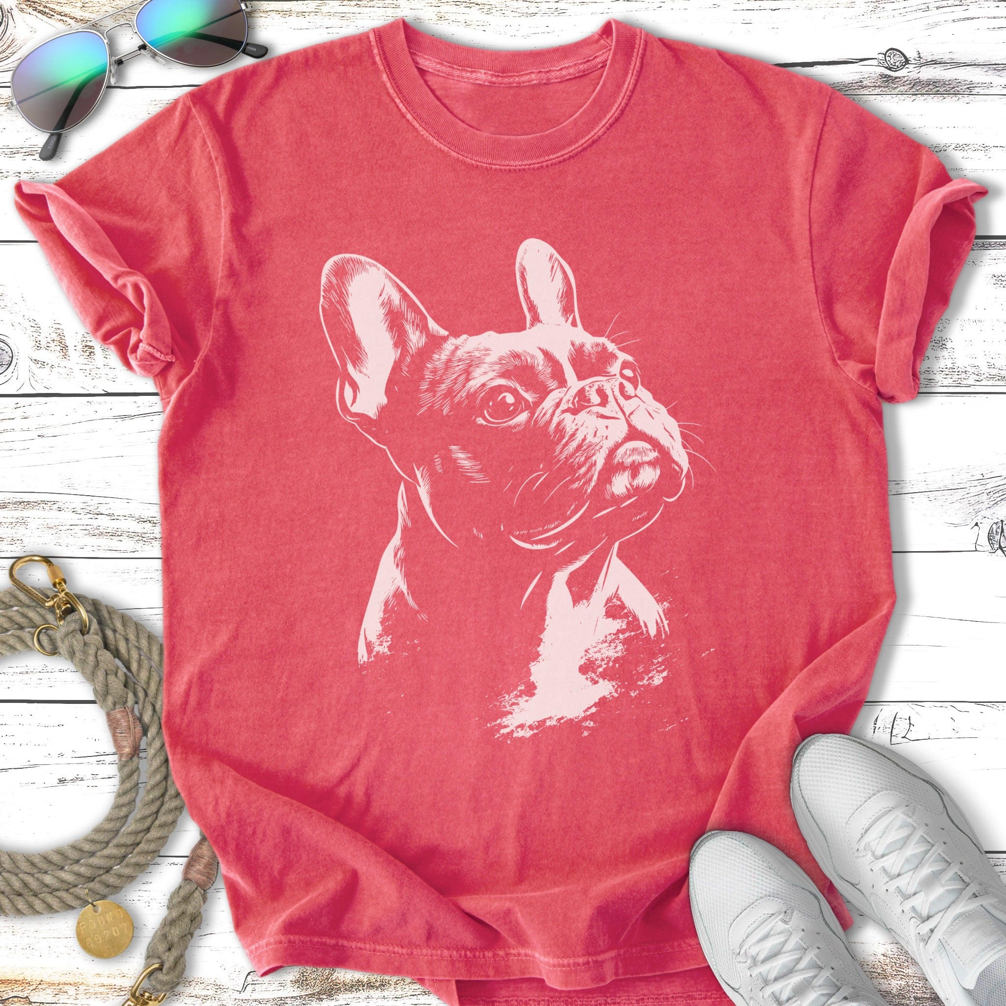 French bulldog graphic on a faded red t-shirt with sunglasses and sneakers.